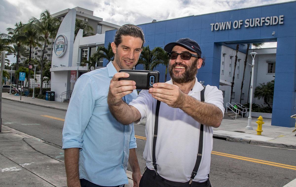 Surfside’s newly elected mayor, Shlomo Dazinger, posed for a selfie with part-time resident Jerry Freund in front of the Town Hall Building on Wednesday, March 23, 2022.