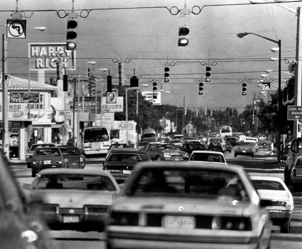 Biscayne Boulevard looking north from 79th Street and to a Harry Rich carpet store in 1983.