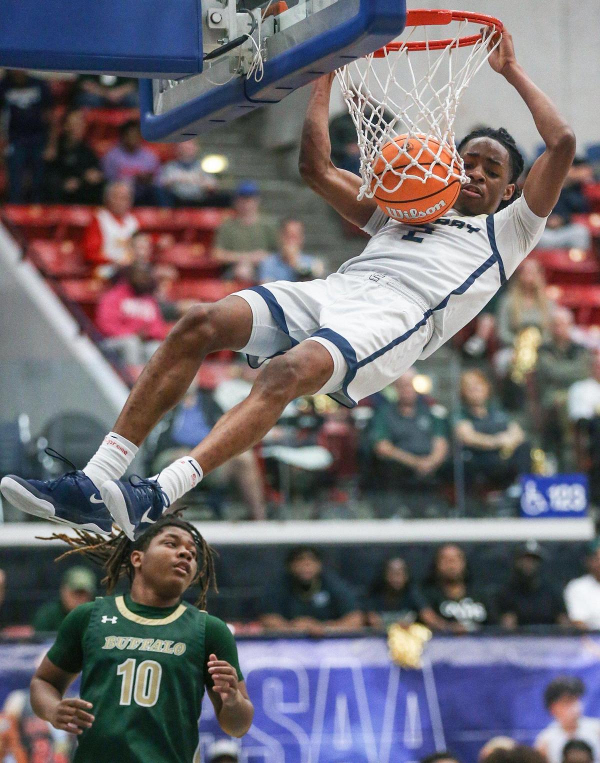 Calvary Christian’s Kenneth Francis Jr. (2) dunks the ball against the Villages in the first half during the FHSAA Class 3A Boys High School Basketball State Championship at the RP Funding Center in Lakeland, Florida on Saturday, March 1, 2025.