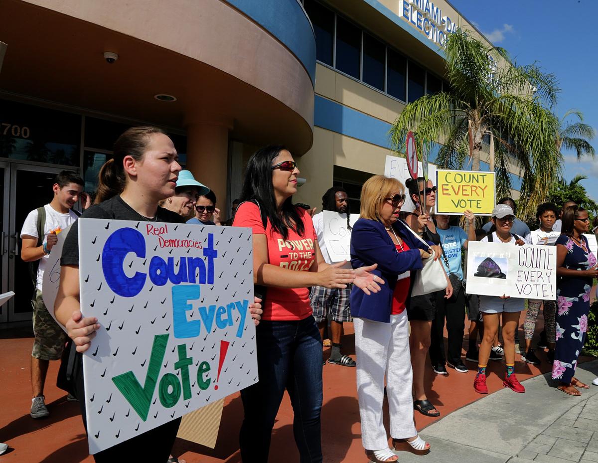 A group of activists protested in front of the Miami-Date Elections Department on Saturday, Nov. 10, 2018, demanding that all ballots from the county’s mid-term elections be counted.