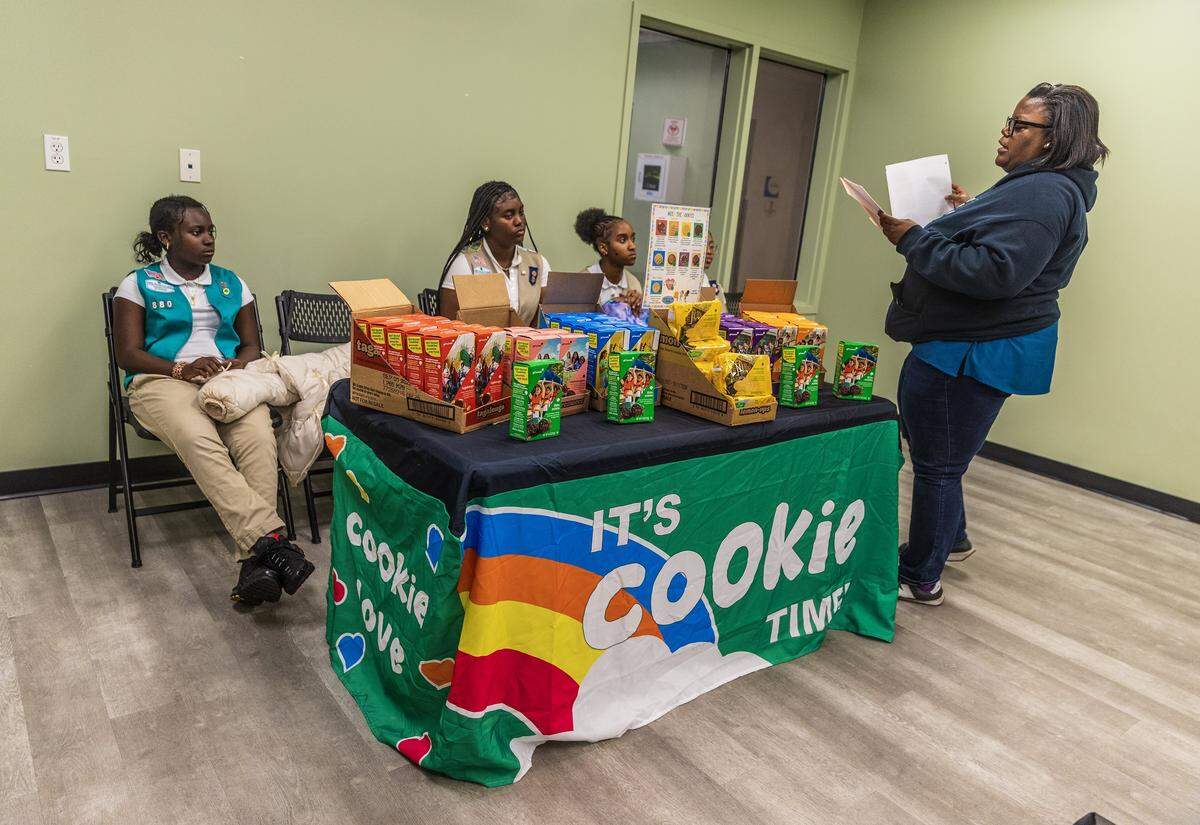 Volunteer Kenika Coakley, leads a meeting about key business lessons including selling cookies, with a group of Girl Scouts that will help them in life, at the Betty T. Ferguson Recreational Complex, in Miami Gardens, on Tuesday, January 28, 2026.