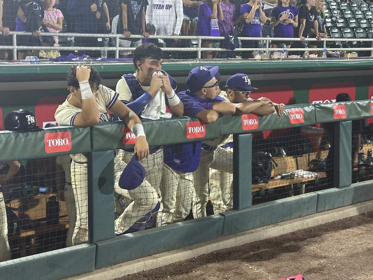 A dejected group of True North players watches on after the Titans lost 8-4 to Jacksonville Trinity Christian in the Class 2A state baseball final at Hammond Stadium in Fort Myers, Fla.