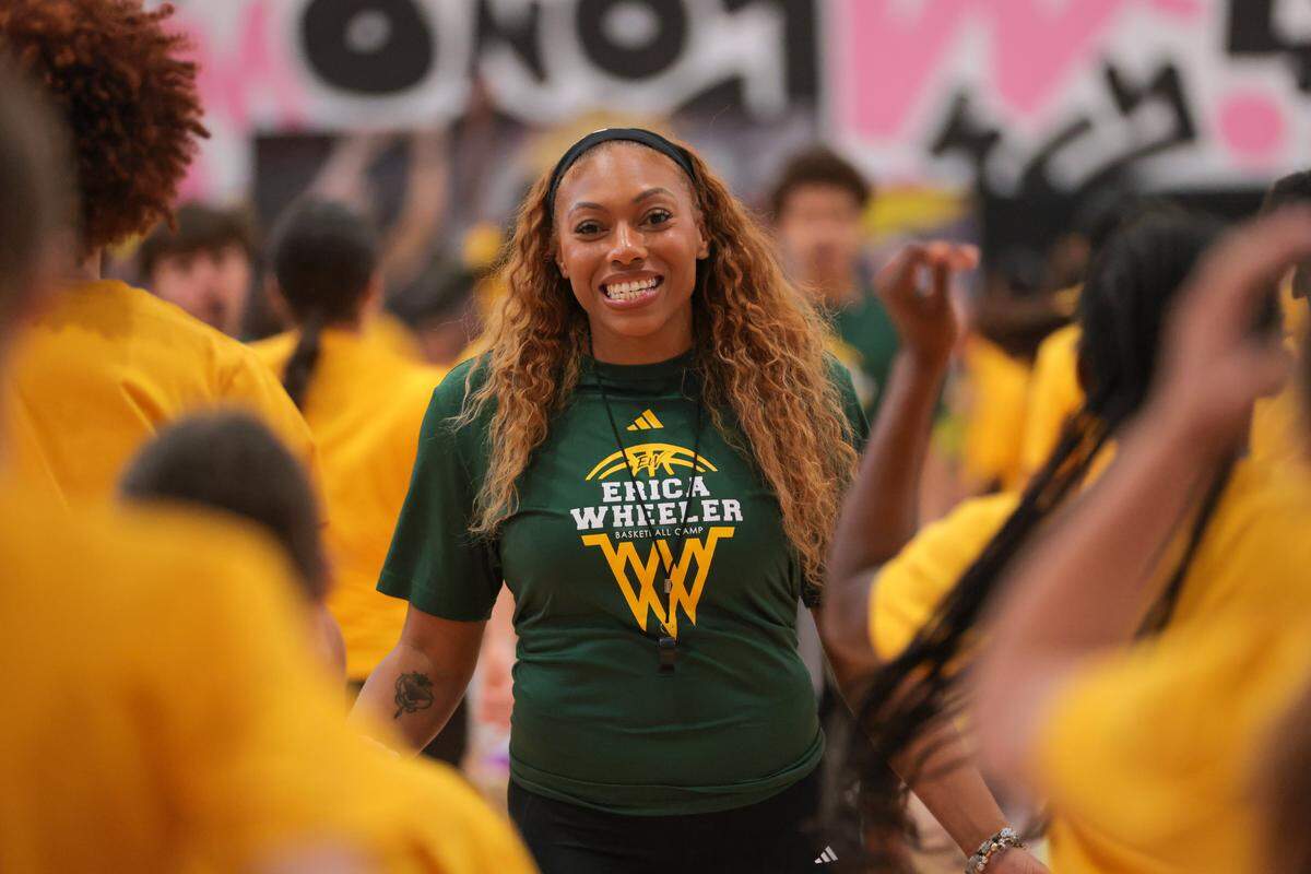 WNBA basketball player Laney Hamilton welcomes camper during the Erica Wheeler Basketball Camp at Bucky Dent Park at 2240 W 60th St., in Hialeah, Florida, Saturday, October 18, 2025.