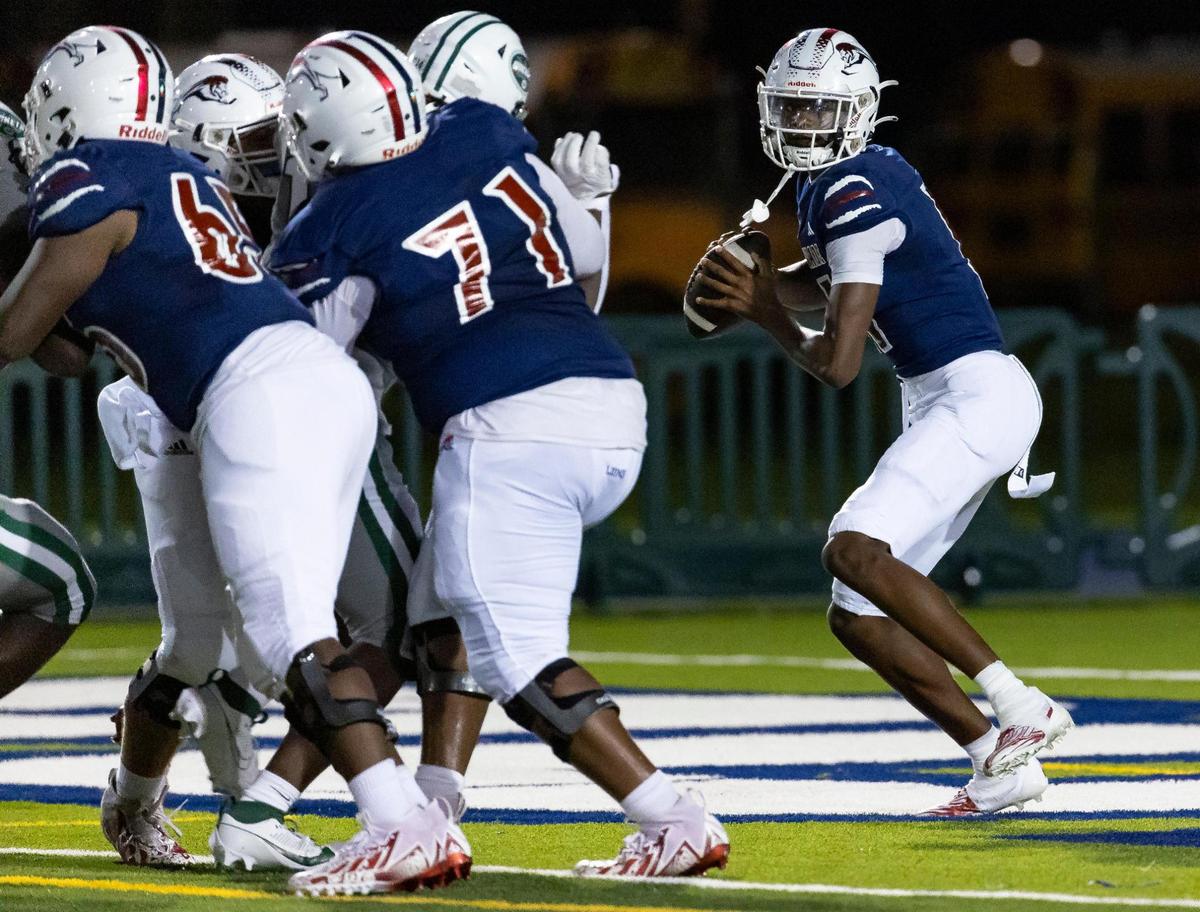 Chaminade-Madonna Lions quarterback Cedrick Bailey (11) looks to throw the ball in the first quarter of a high school football game against the Central Rockets at the Nathaniel Traz Powell Stadium on Thursday, Sept. 21, 2023, in Miami, Fla.