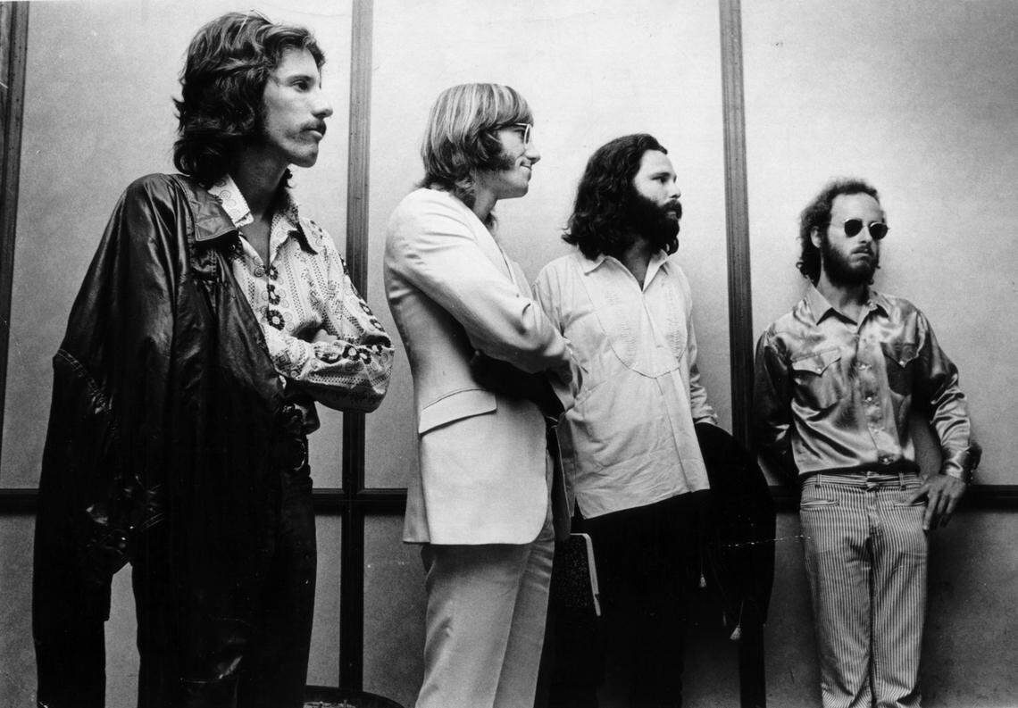 The Doors, From L to R: Bandmates John Densmore, Ray Manzarek, Jim Morrison, and Robby Krieger. The band keeps Jim Morrison company during his trial at the Metro Justice Building.