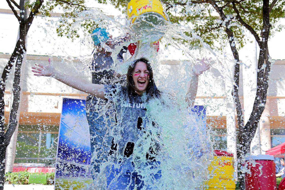 Monica Roos gets a Gatorade splash during a Give Miami Day event at the Thomson Plaza for the Arts at the Arsht Center for the Performing Arts, in Miami, Florida, on Thursday, Nov. 21, 2019.