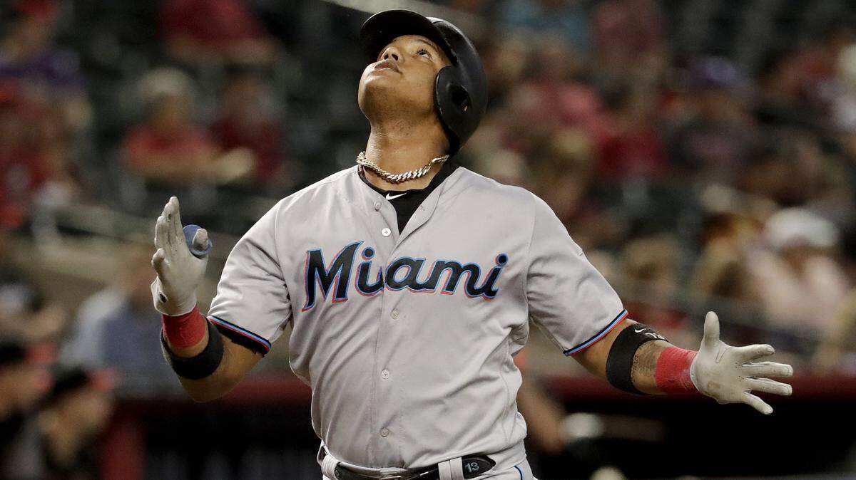 Miami Marlins’ Starlin Castro celebrates after hitting a solo home run against the Arizona Diamondbacks during the first inning of a baseball game, Wednesday, Sept. 18, 2019, in Phoenix. 