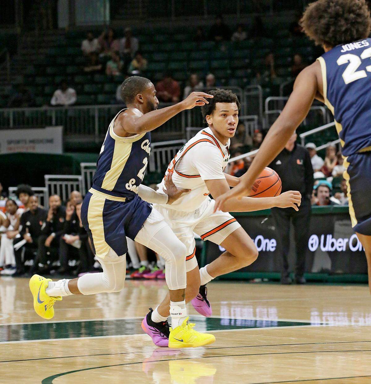 UM Hurricanes Divine Ugochukwu (99) plays against Charleston Southern University Buccaneers during the basketball game on Saturday, November 30, 2024 at Watsco Center in Coral Gables. Andrew Uloza / for Miami Herald