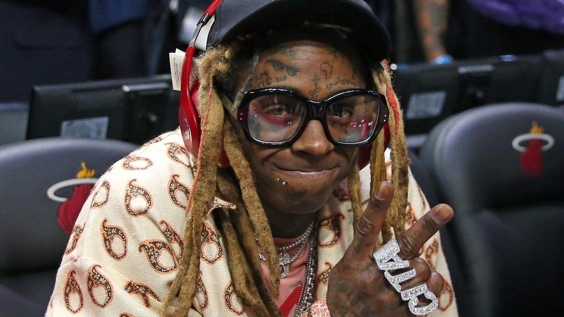 Rapper Lil Wayne pose for the picture after an NBA basketball regular season game between Los Angeles Lakers against the Miami Heat at the AmericanAirlines Arena on Friday, December 13, 2019 in Miami. Lakers won 113-110.