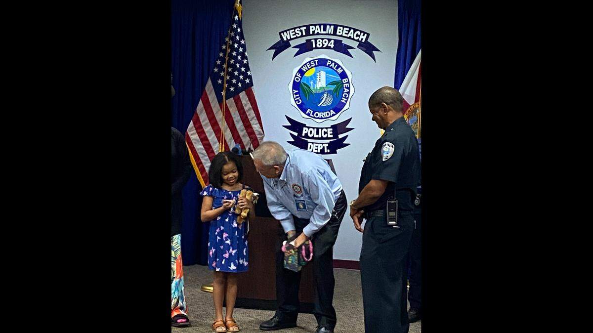 West Palm Beach police officials honored Journee Nelson, 9, for bravery on Tuesday, Nov. 16, for fighting off a man who attacked her mother earlier this month.