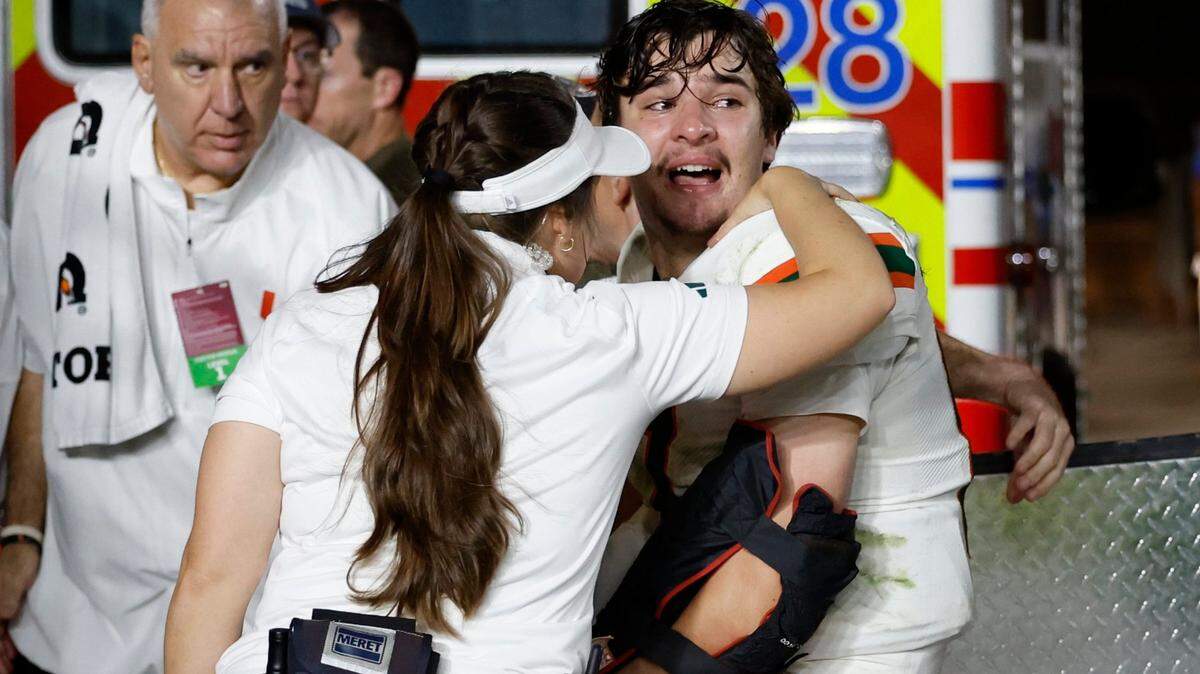 An injured Miami Hurricanes quarterback Emory Williams (17) is attended to by medical staff late in the fourth quarter during the game against the Florida State Seminoles during the fourth quarter at Doak Campbell Stadium in Tallahassee on Saturday, November 11, 2023.
