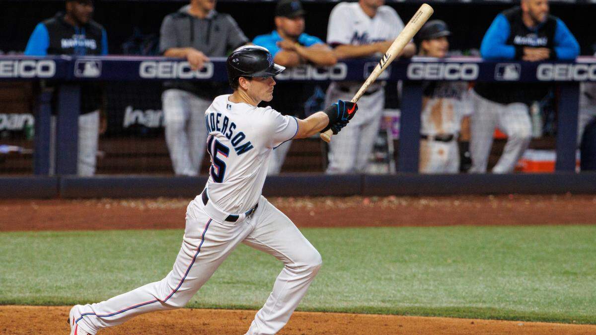 Miami Marlins second baseman Brian Anderson (15) hits a two run walk-off triple during the eleventh inning of a baseball game against the Pittsburgh Pirates at LoanDepot Park on Thursday, July 14, 2022 in Miami, Florida.
