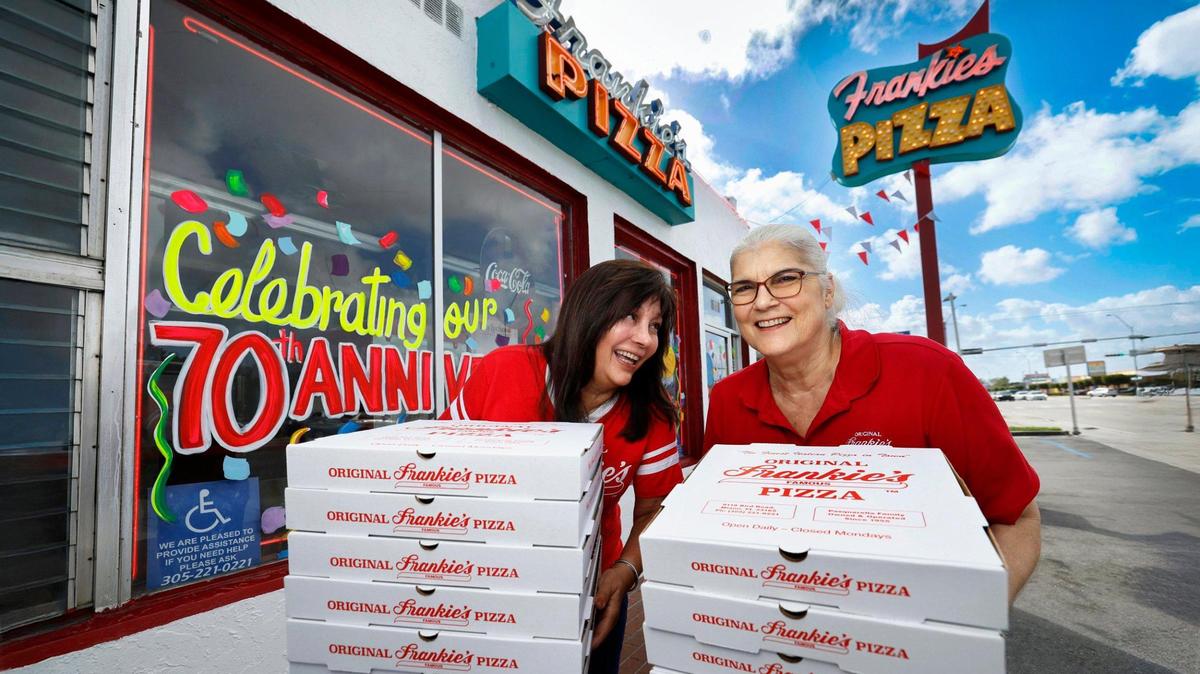 Renee and Roxanne Pasquarella, daughters of the original owners Frank and Doreen Pasquarella, in front of Frankie’s Pizza on Bird Road in Miami. The restaurant just celebrated its 70th anniversary.