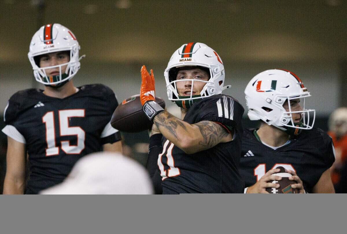 Quarterback Carson Beck (11) looks for an open teammate during Miami Hurricanes football practice on Wednesday, Aug. 6, 2025, at University of Miami in Coral Gables, Fla.