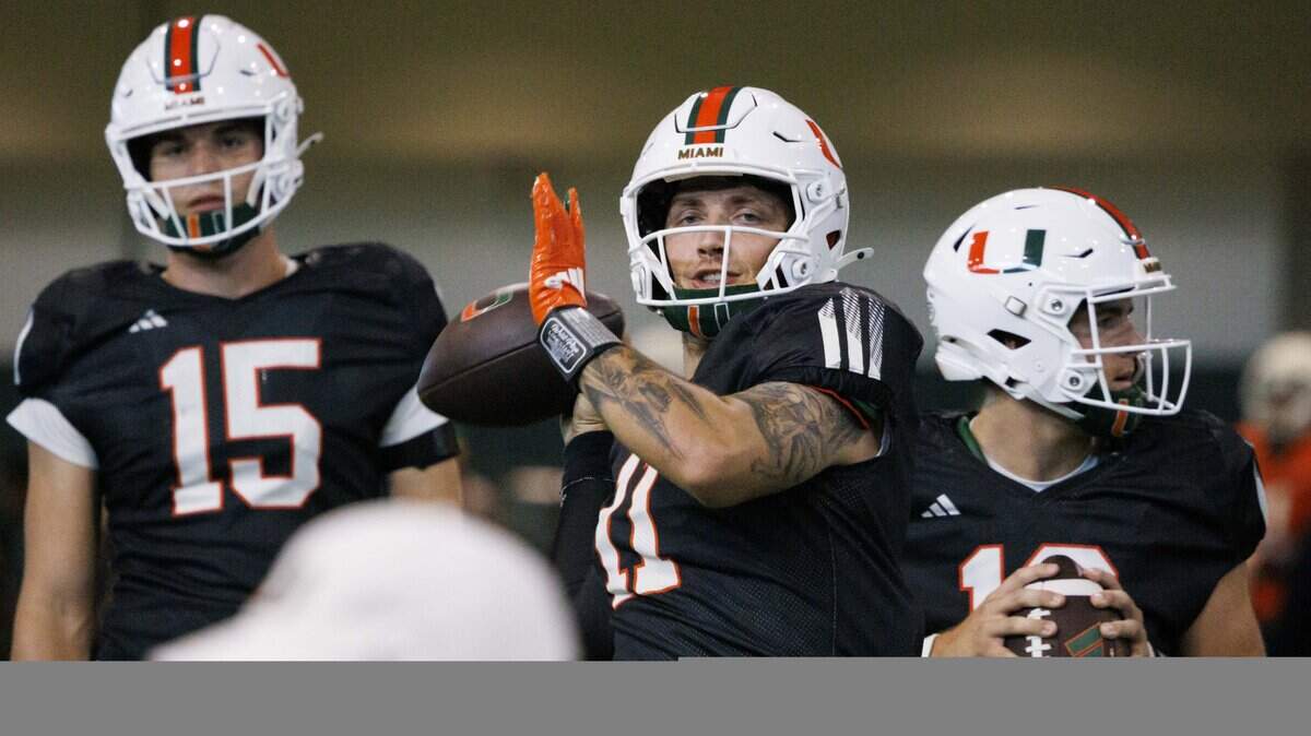 Quarterback Carson Beck (11) looks for an open teammate during Miami Hurricanes football practice on Wednesday, Aug. 6, 2025, at University of Miami in Coral Gables, Fla. 