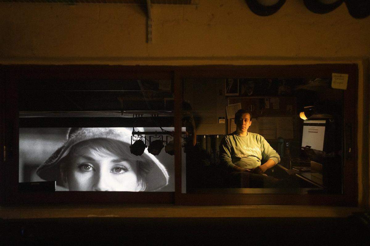 Tech and Media Manager and Projectionist, Kevin de los Cuetos, plays "400 Blows" as the historic theater prepares to expand, in Coral Gables on Sunday August 3rd. 2025.
