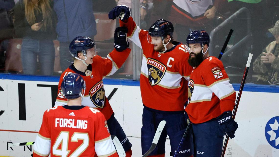 Florida Panthers center Aleksander Barkov (16) is congratulated by teammates Anton Lundell (15) Radko Gudas (7) and Gustav Forsling (42) after scoring a handed goal during the first period of an NHL game against the Vegas Golden Knights at the FLA Live Arena on Thursday, January 27, 2022 in Sunrise, Fl.