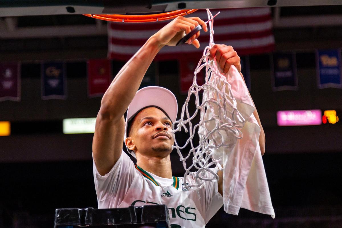 Hurricanes guard Isaiah Wong cuts the hoop after defeating the Pittsburgh Panthers 78-76 to become regular season Co-Champs and the first seed for the ACC Tournament during an NCAA basketball game at Watsco Center in Coral Gables, Florida, on Saturday, March 4, 2023.