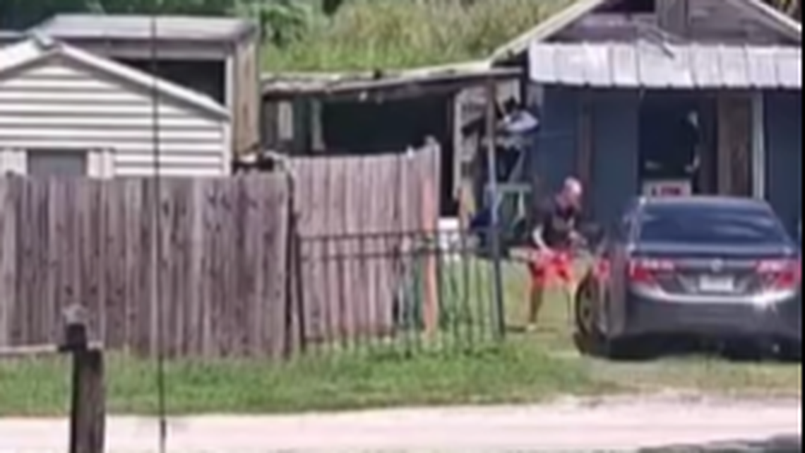 Video released by the sheriff’s office shows the 25-year-old father was holding the boy as he tried to run from the vehicle at the couple’s home in Lake Wales.
