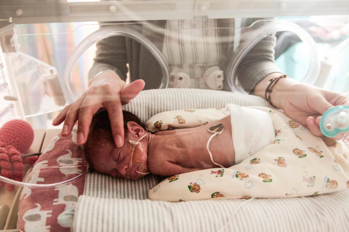 Sagri checks on Diana, one of her quadruplet daughters, at Nicklaus Children’s Hospital, which recently opened a 10-bed maternity unit for mothers of high-risk infants.