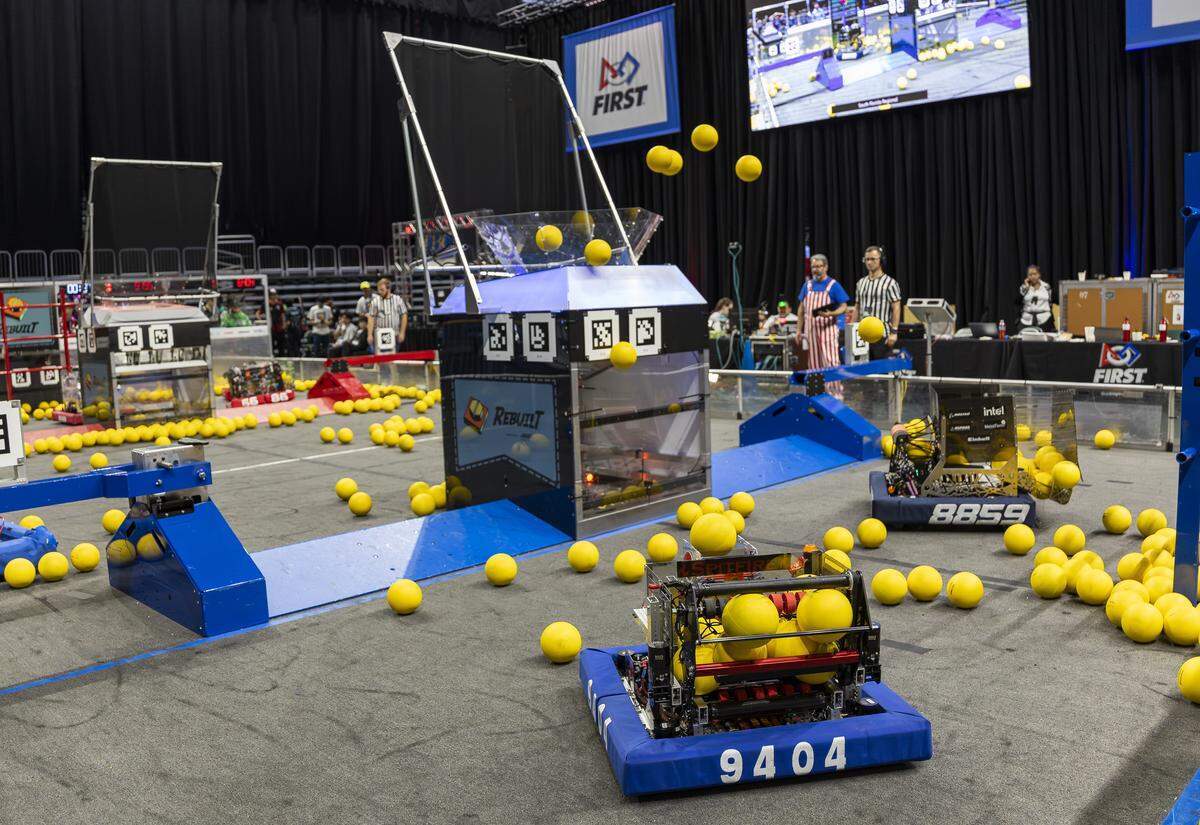 Students from Team 9404 Forge and Team 8859 Bora Robotics participate in the 2026 FIRST Robotics South Florida Regional Competition at the University of Miami’s Watsco Center on Friday, April 10, 2026, in Coral Gables, Fla. Participants from local school districts, surrounding states, and international teams are competing for an opportunity to earn a spot at the 2026 FIRST World Championship.