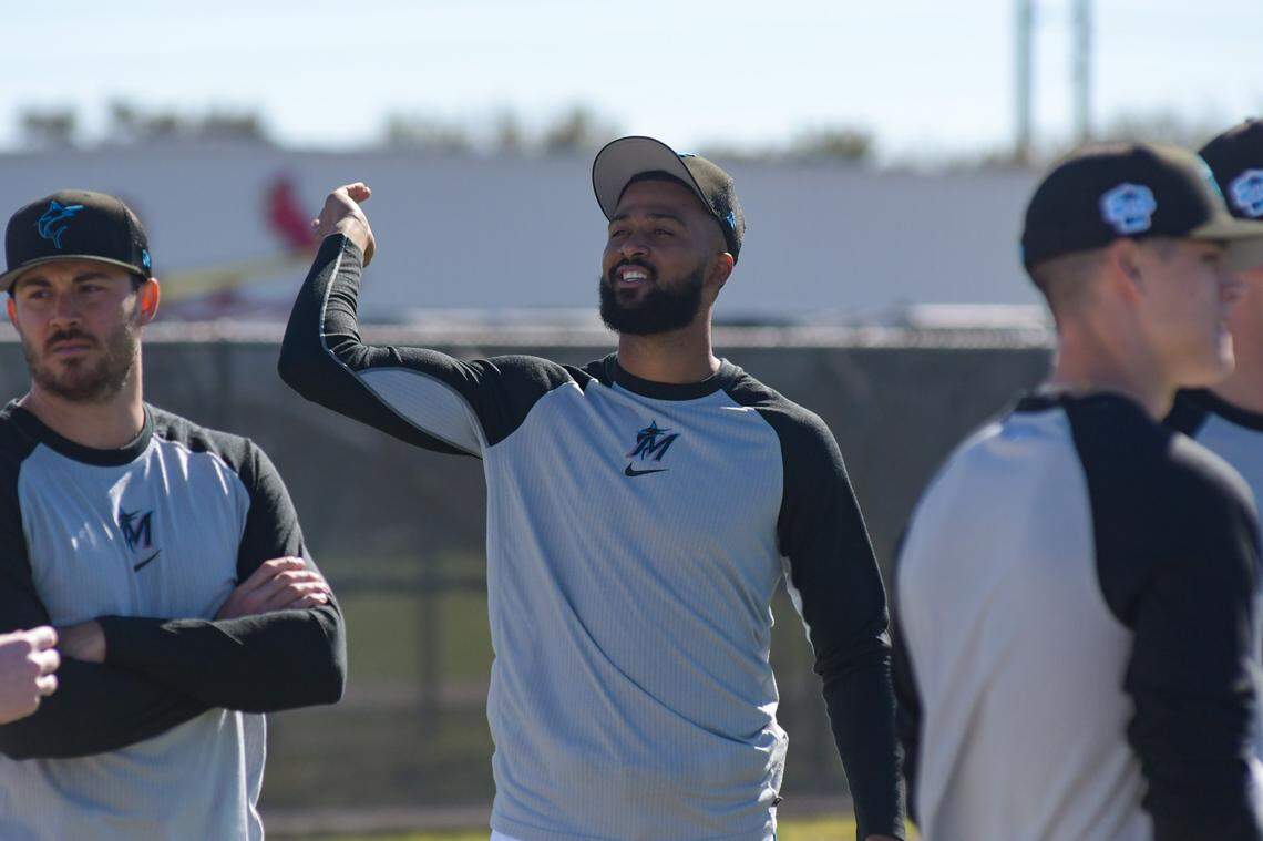 Miami Marlins right-handed pitcher Sandy Alcantara stretches prior to a workout on the back fields of the Roger Dean Chevrolet Stadium complex in Jupiter, Florida, on Monday, Feb. 13, 2023.