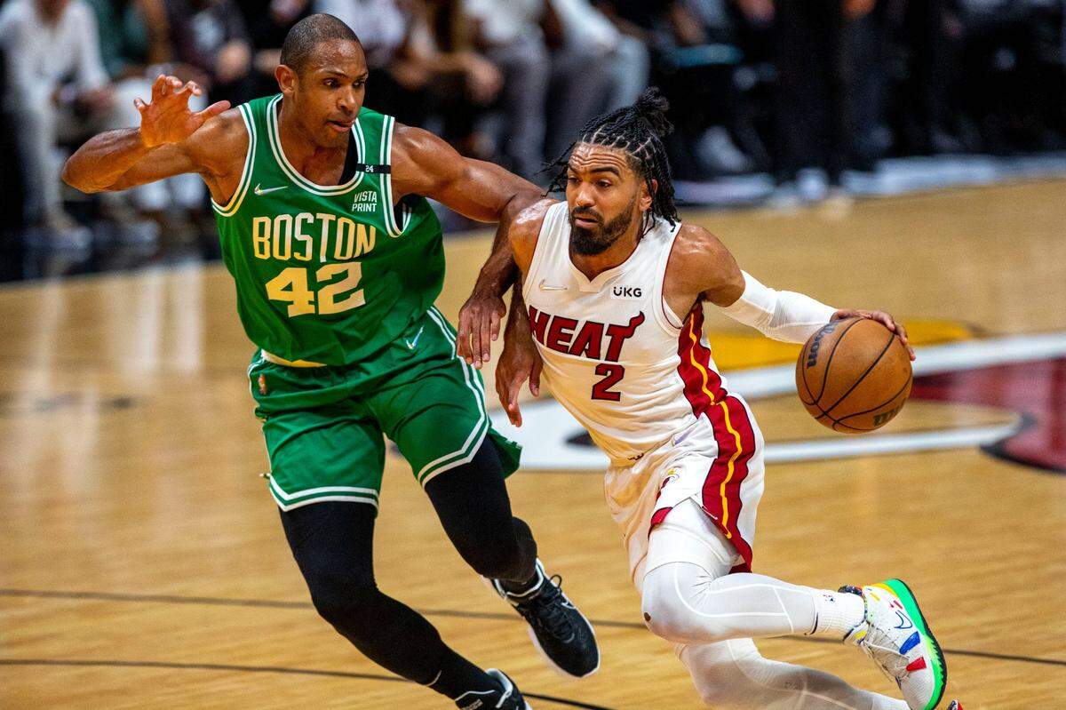 Miami Heat point guard Gabe Vincent (2) drives to the rim while defended by Boston Celtics center Al Horford (42) during the first quarter of Game 2 of the NBA Eastern Conference Finals series at FTX Arena in Miami on May 19, 2022.