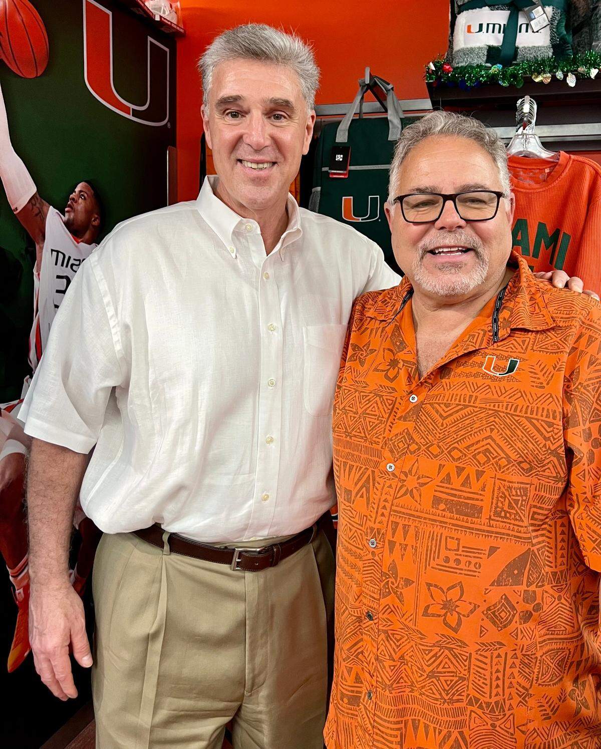Miami athletic director Dan Radakovich stands with allCanes general manager Harry Rothwell on Monday, Dec. 12, 2022 at the 22nd annual allCanes Shopping Spree for Kids.