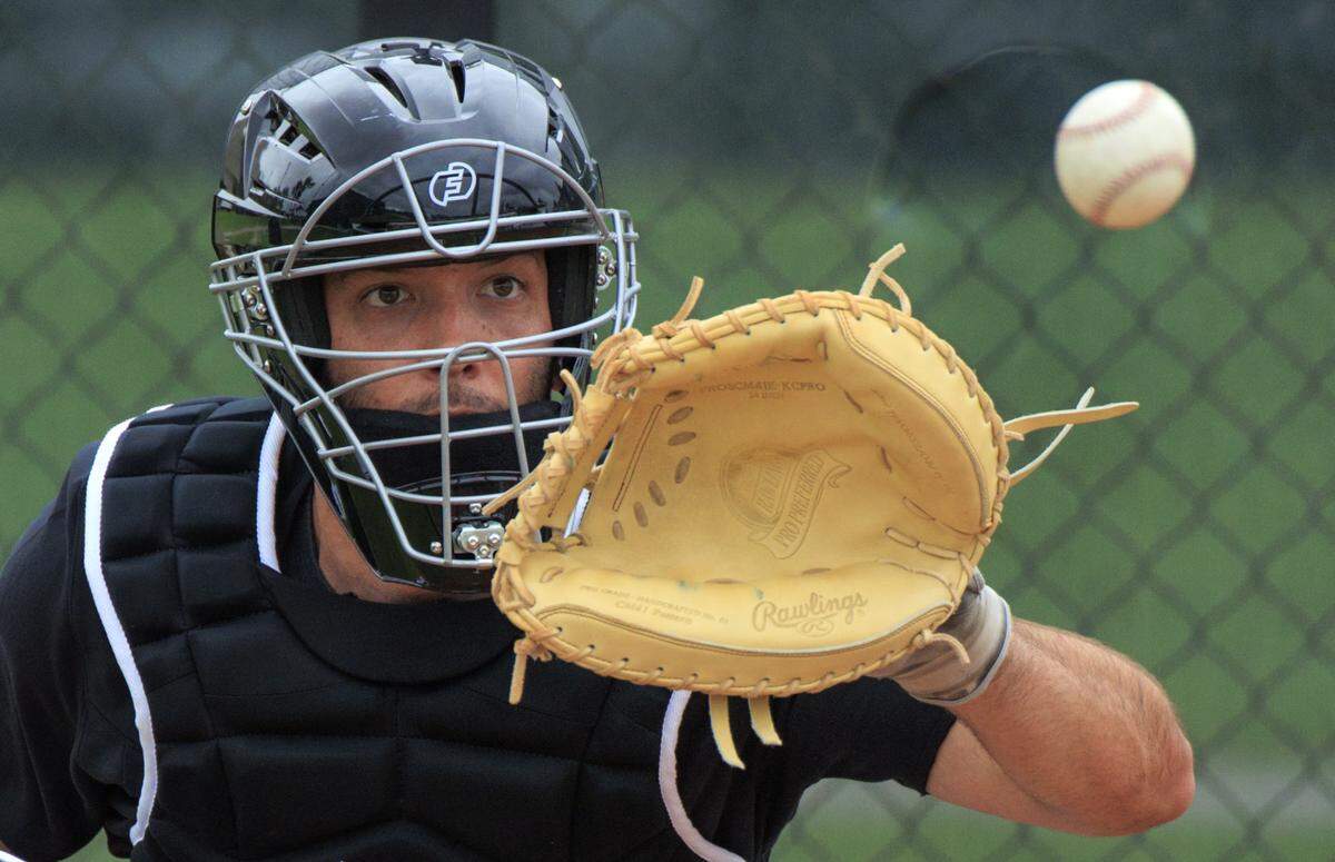 Miami Marlins catcher Jacob Stallings runs drills during a spring training workout at Roger Dean Stadium on Tuesday, March 15, 2022, in Jupiter.