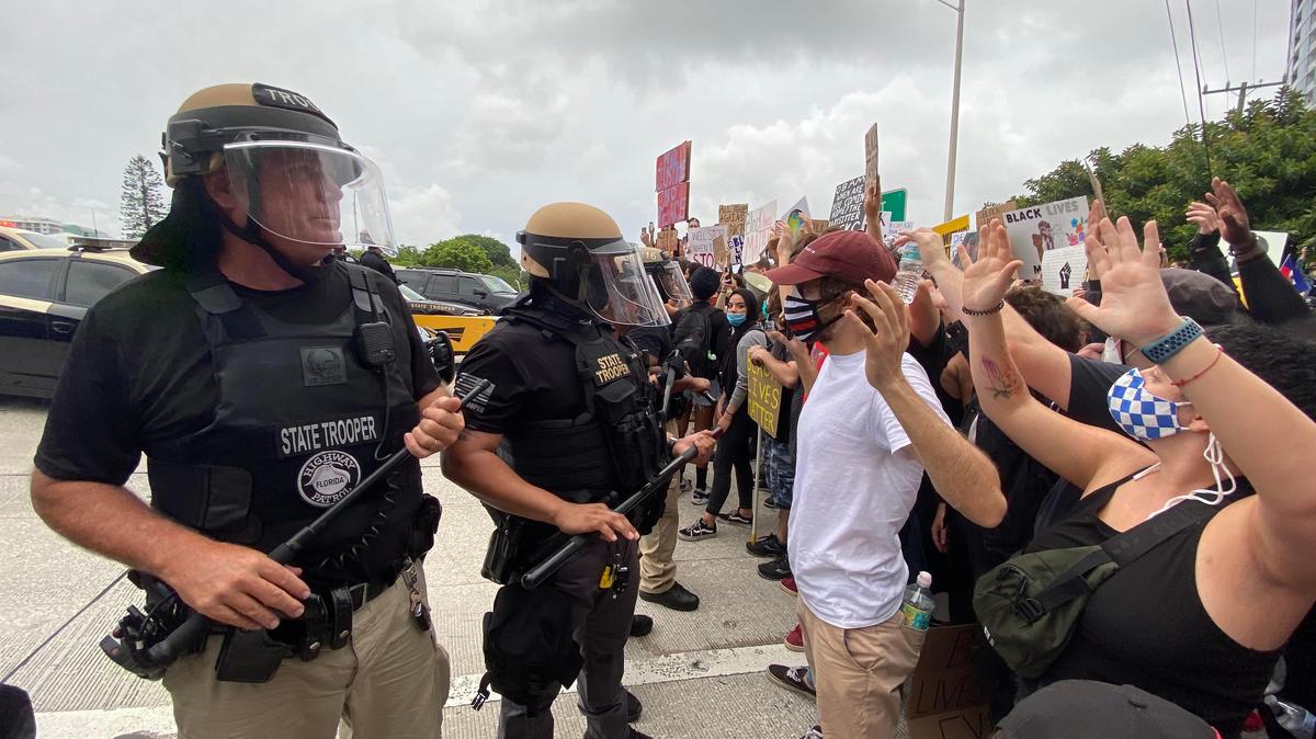 Protesters and Florida Highway Patrol officers meet on one of the ramps of the Julia Tuttle Causeway on Friday, June 5, 2020, during a “Justice for George Floyd” march that began in Wynwood.
