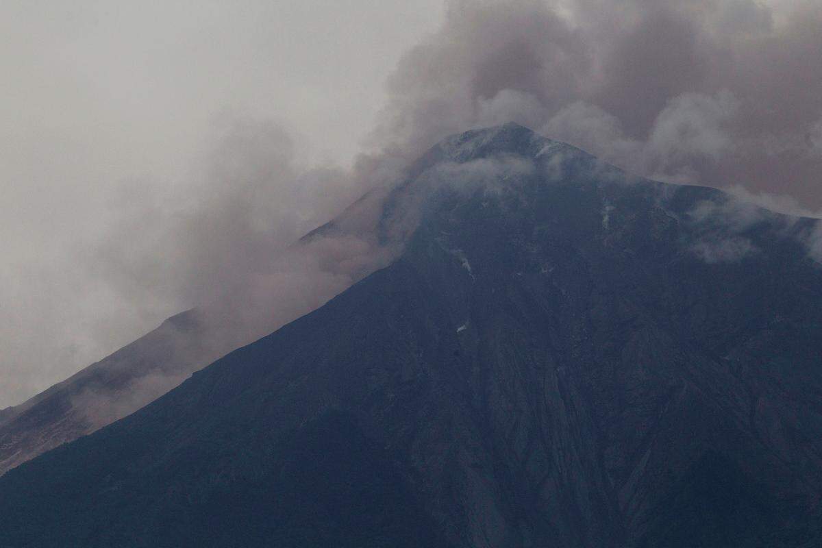 Volcan de Fuego, or Volcano of Fire, blows out a thick cloud of ash, as seen from Alotenango, Guatemala, on Sunday, June 3, 2018.