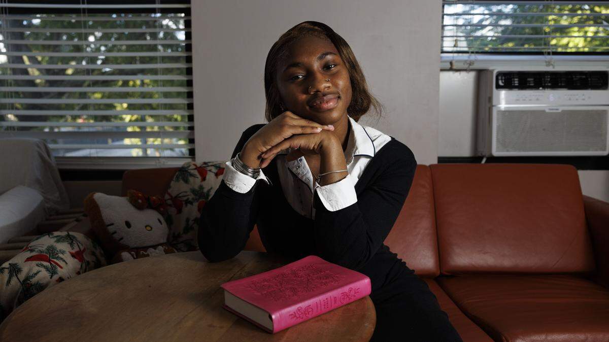 Ifetayo Frye, 19, poses inside the apartment that she shares with a roommate at Casa Valentina, a home for unhoused young people. Frye grew up in a congested and chaotic home. “When you don’t have a lot of room to grow at home, you find it somewhere else, and learning always came really easy to me,” said Frye.
