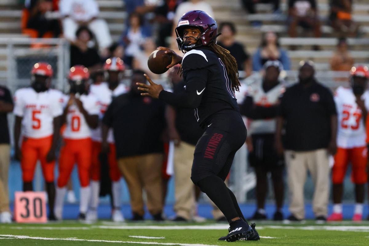 Norland Vikings quarterback Ennio Yapoor (17) throws the football against the Carol City Chiefs during the first quarter of a high school football game at Nathaniel Traz Powell Stadium in Westview, Florida, on Friday, August 30, 2024.