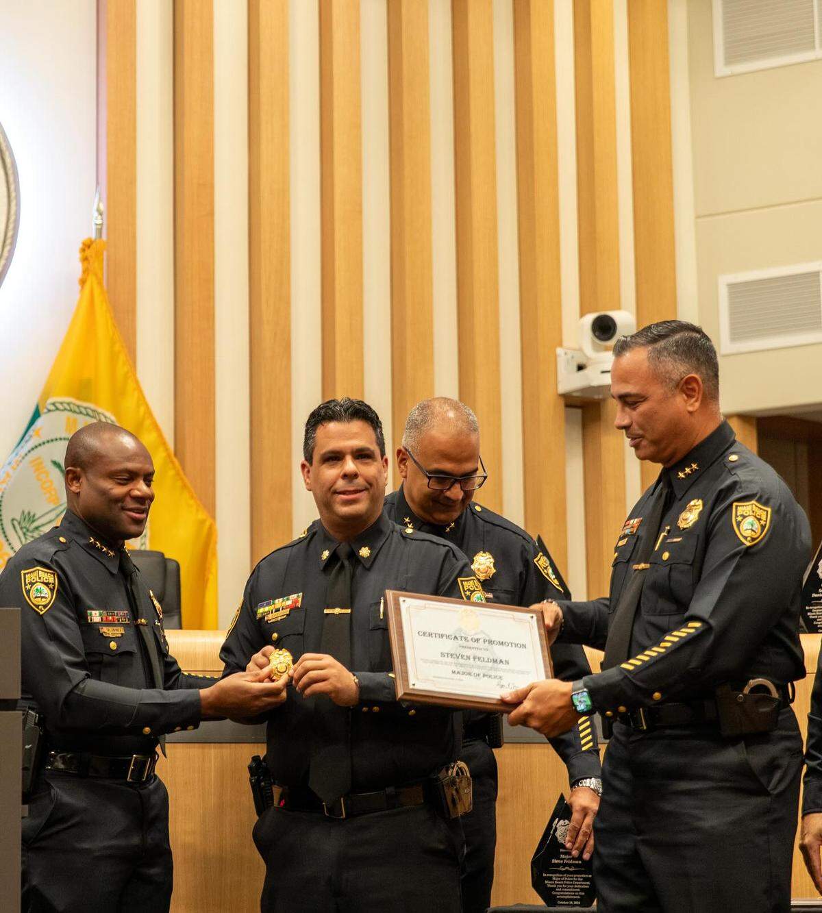 Miami Beach Police Chief Wayne Jones (left) promoted Steven Feldman (center) from captain to major in a ceremony at Miami Beach City Hall on Oct. 14, 2024.