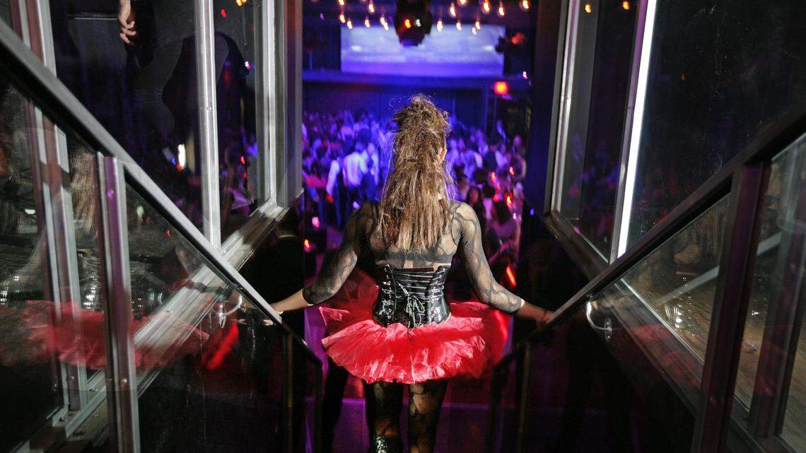 A clubgoer gets down the stairs at the private opening of Shock Nightclub in South Beach in 2010.