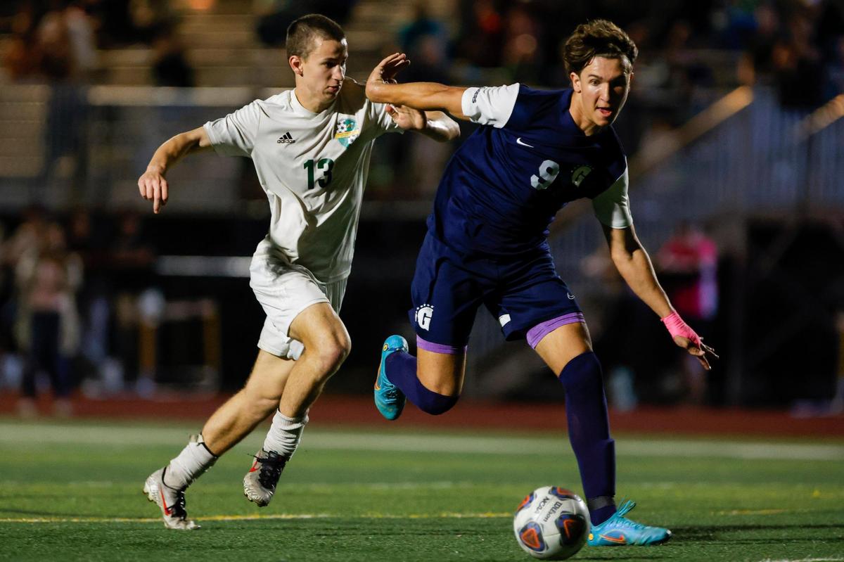 Gulliver Raiders Tomas Sciarra (9) runs with the football ahead of Yulee Hornets Joe Walsh (13) during the second half of the Region 4-4A semifinal game at Belen Jesuit Preparatory School in Tamiami, Florida on Saturday, February 18, 2023.