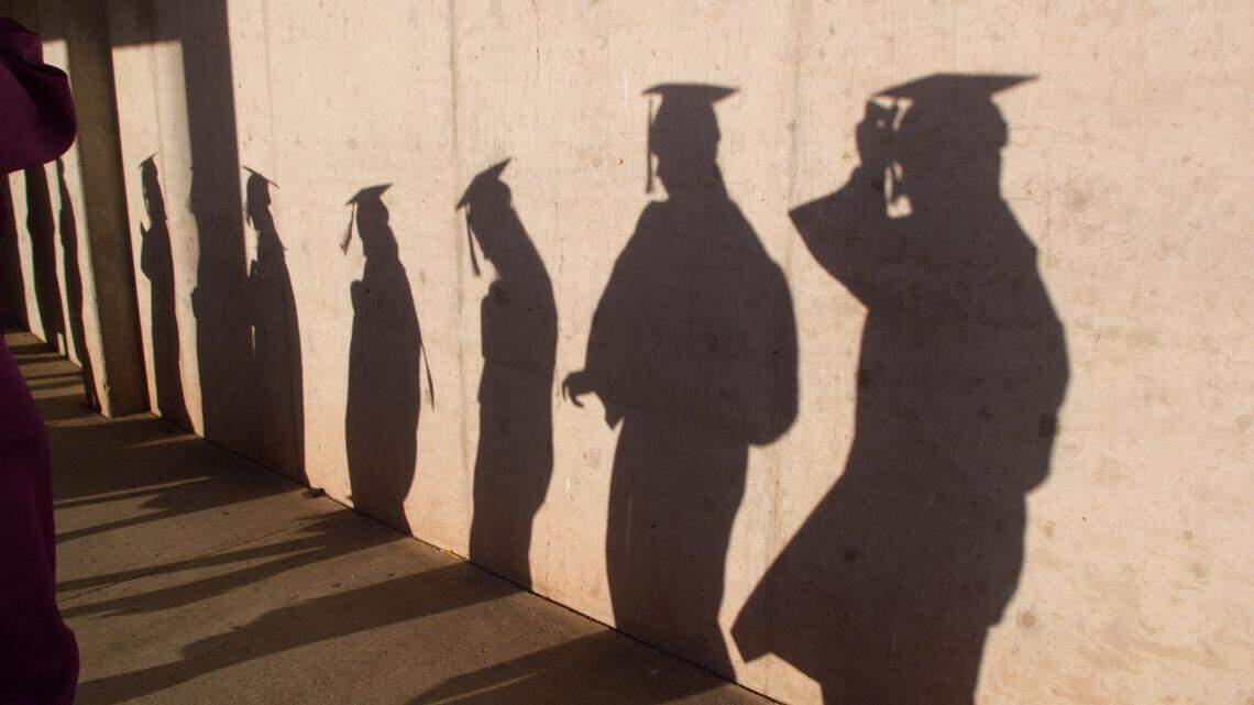 The shadows of students graduating are shown in this file photo.