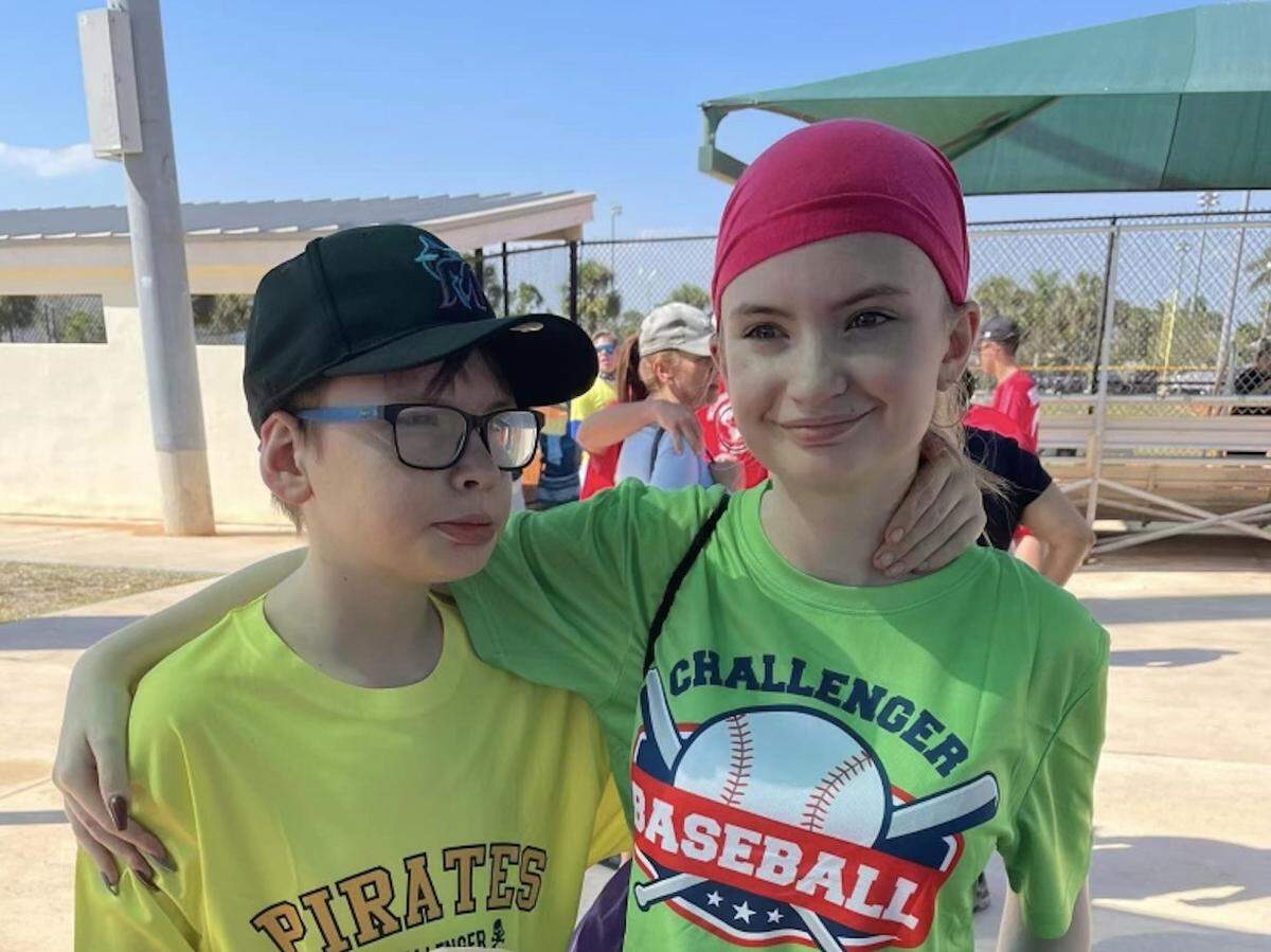 Ethan Feaster, left and his sister Jazmin after a game at Challenger Baseball, a league for kids with special needs. Ethan plays and Jazmin is a “buddy” who assists the kids on the field.