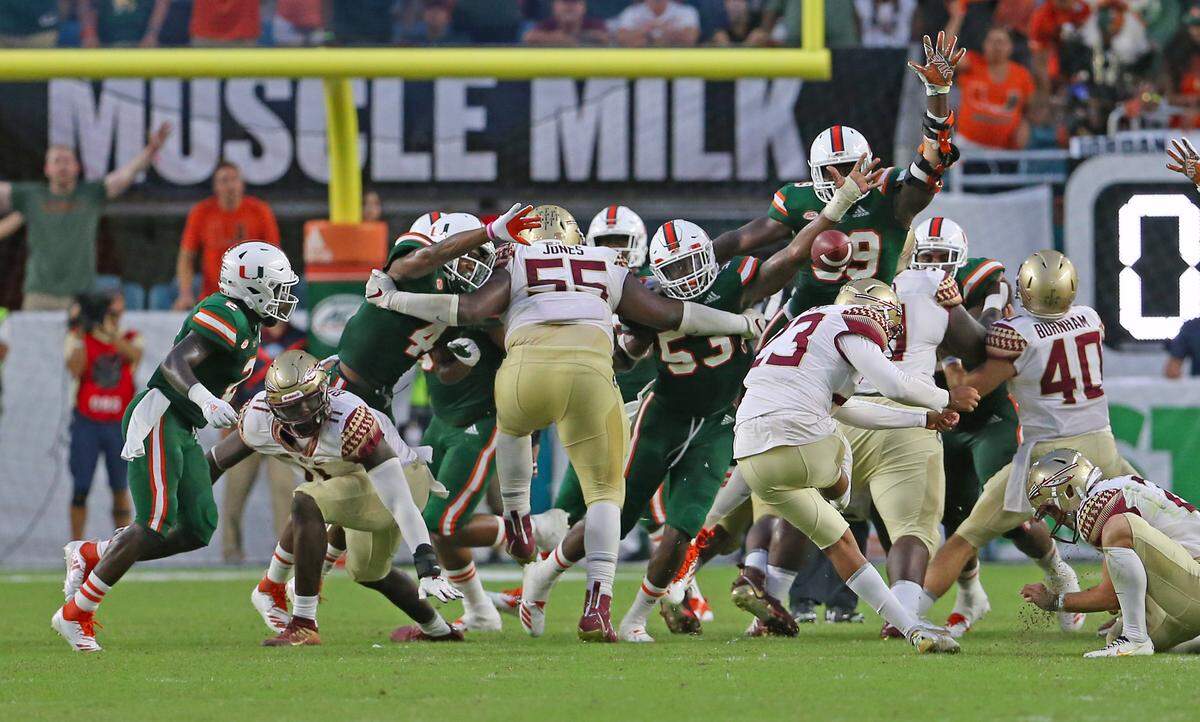 Miami Hurricanes linebacker Zach McCloud blocks a field goal by Florida State Seminoles kicker Ricky Aguayo in the fourth quarter of an NCAA college football game at Hard Rock Stadium on Saturday October 6, 2018, in Miami Gardens.