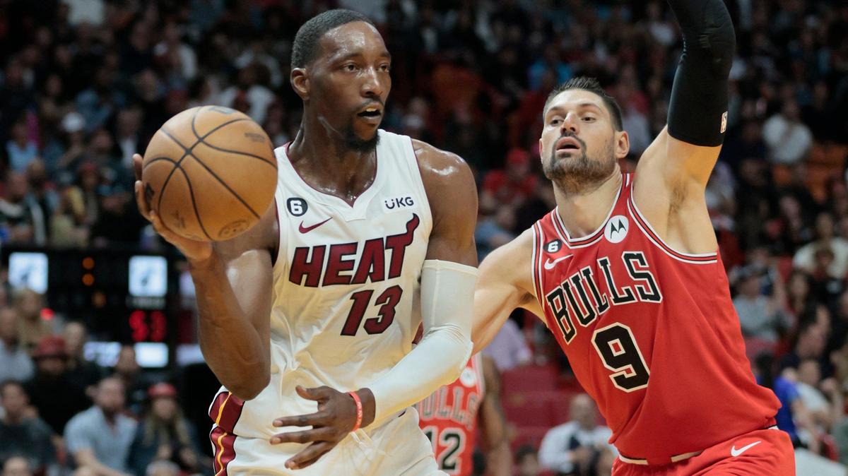 Miami Heat center Bam Adebayo (13) looks to pass as Chicago Bulls center Nikola Vucevic (9) defends in the first half at FTX Arena on Wednesday, October 19, 2022.