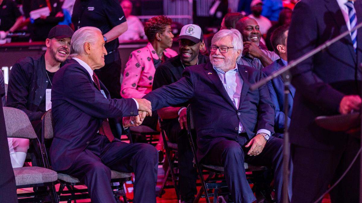 Miami Heat President Pat Riley, left, shares a moment with Heat Owner Micky Arison, right, during a half-time presentation to dedicate the court to Riley on Wednesday, October 23, 2024, in Miami, Fla.