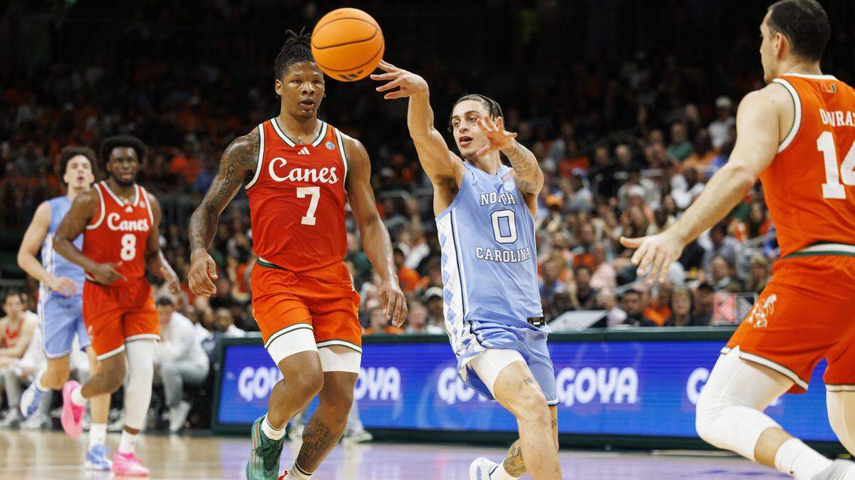 North Carolina Tar Heels guard Kyan Evans (0) passes the ball during the second half of a game against the Miami Hurricanes on Tuesday, Feb. 10, 2026, at the Watsco Center in Coral Gables, Fla. The Miami Hurricanes won 75-66. 