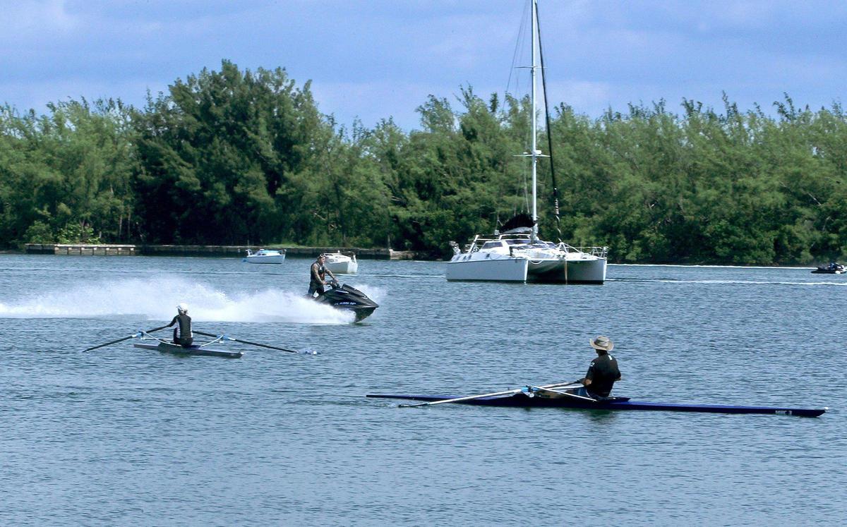 Rowers Sue and Ron Kern, like other rowers and paddlers in the Miami Marine Stadium basin, worry about getting swamped or plowed over by water bikers. A huge increase in water bike and powerboat traffic during the coronavirus pandemic has created a chaotic and dangerous situation at the lagoon.