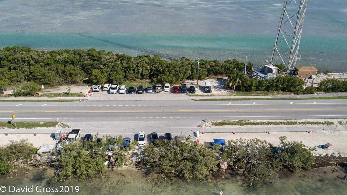 A photo taken by an aerial drone shows Indian Key Fill on July 4, 2019. On busy weekends, the area is usually flooded with parked cars and people. But, the Village of Islamorada implemented temporary measures this year, which locals hope will become permanent, to limit partying, camping and littering there.