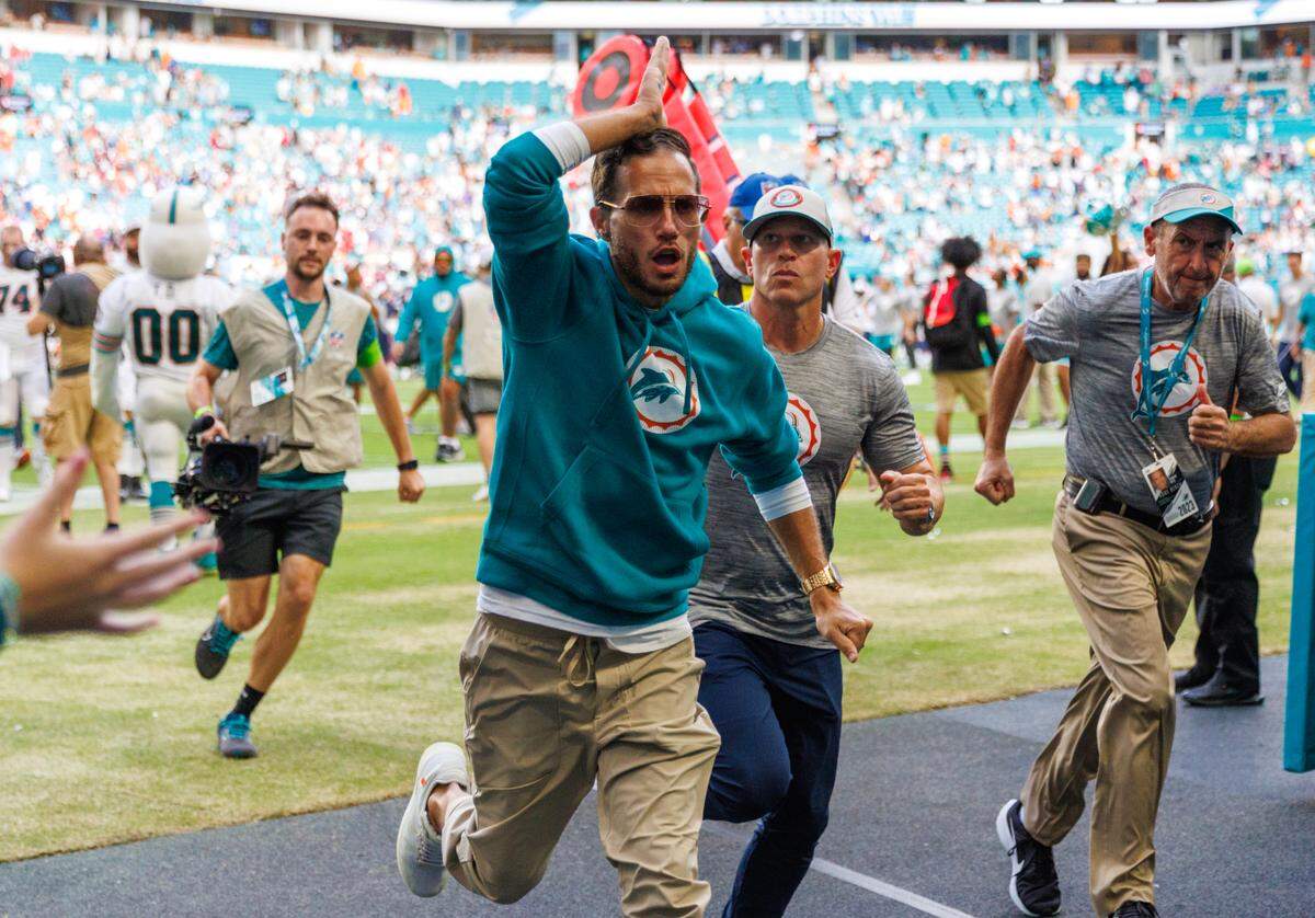 Miami Dolphins head coach Mike McDaniel walk off the field after the Dolphins 31-17 win over the New England Patriots during an NFL football game at Hard Rock Stadium on Sunday, Oct. 29, 2023 in Miami Gardens, Fl.