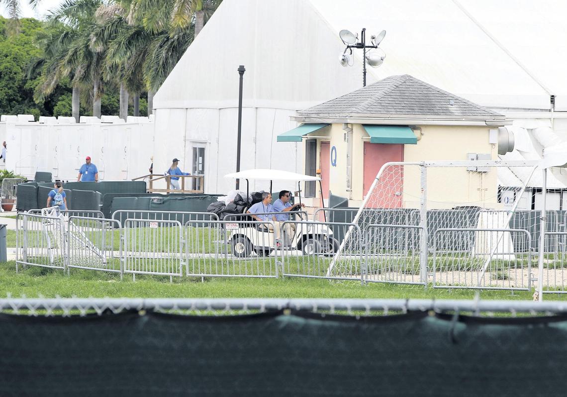 View of workers inside the Homestead Detention Center after the government announcement that it will close this facility for unaccompanied minors. The remaining children were transferred out of the facility early Saturday.
