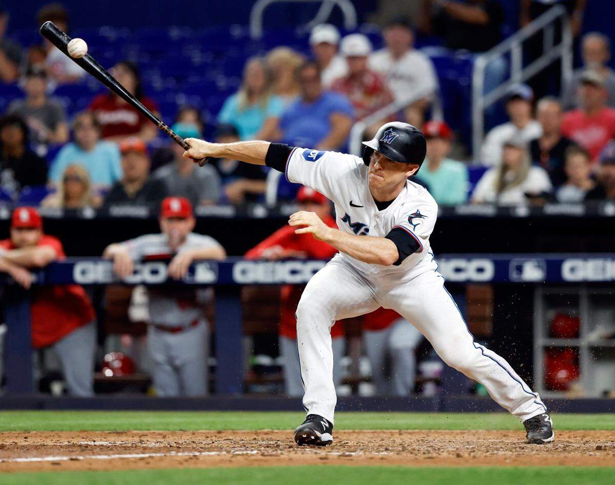 Miami Marlins shortstop Joey Wendle (18) singles on a soft ground ball to St. Louis Cardinals pitcher Jordan Hicks. Garrett Hampson (1) and Yuli Gurriel (1) scores. Wendle advances to second after a throwing error by pitcher Jordan Hicks in the 9th inning as the Marlins win the game at loanDepot park in Miami on Wednesday, July 5, 2023.