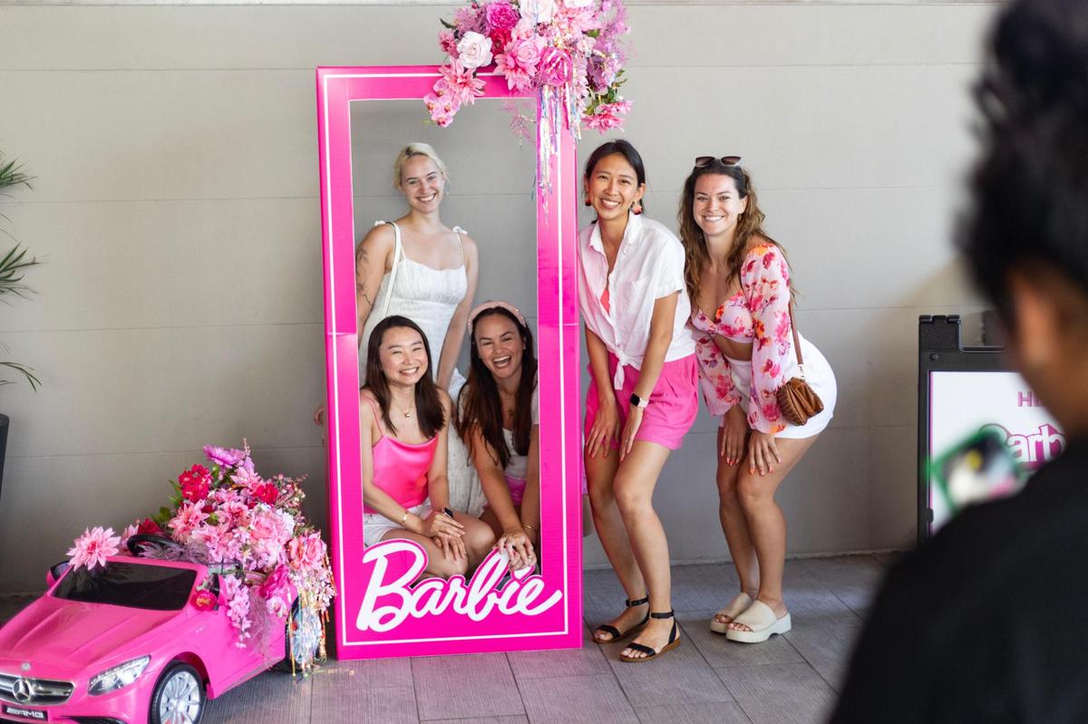 Left to right: Annie Li, Julie Helmers, Catie Carberry, Julie Xie and Rachel Wisniewski pose together by the Barbie box at Cinépolis Coconut Grove in Miami, Fla., on Sunday, July 23, 2023.