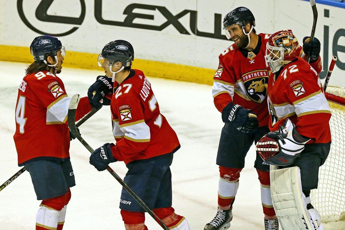 Florida Panthers Aaron Ekblad (5) celebrates with goalie Sergei Bobrovsky (72) after defeating the Detroit Redwings at the BB&T Center in Sunrise, Florida, Tuesday, February 9, 2021.