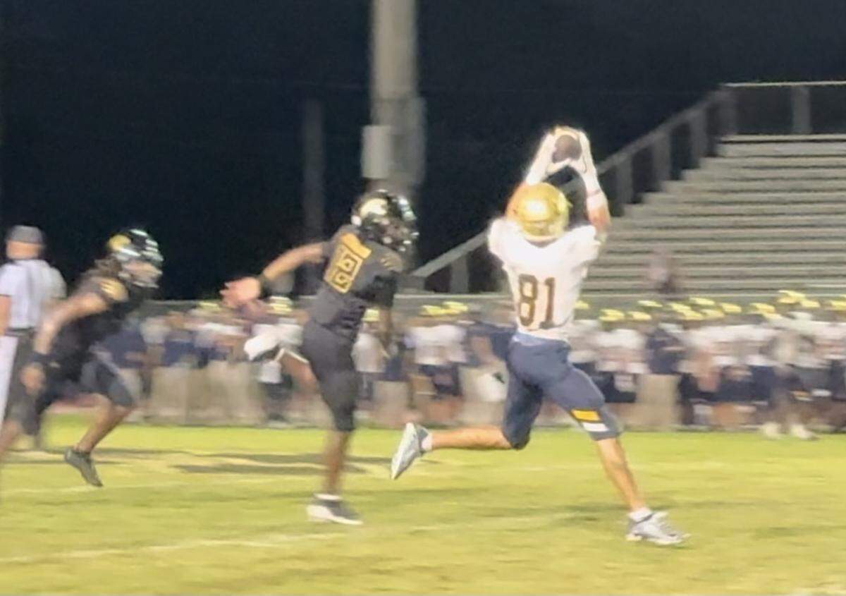 St. Thomas Aquinas wide receiver Julius Jones makes a nice catch over the middle during the Raiders’ win over Western High on Friday in Davie, Fla. Jones caught two touchdown passes.